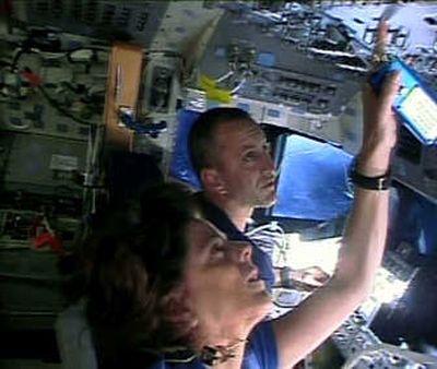 
In this image from NASA TV, Endeavour pilot Charles Hobaugh and mission specialist Barbara Morgan work on the flight deck of the shuttle Monday.Associated Press
 (Associated Press / The Spokesman-Review)