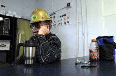 
During his lunch break, Ken O'Riley  talks Thursday about his 38 years of work at the DeArmond mill. 