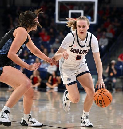Gonzaga’s Brynna Maxwell, who scored 14 points, drives against Western Washington’s Brooke Walling in Friday’s exhibition.  (COLIN MULVANY/THE SPOKESMAN-REVIEW)