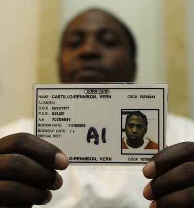 Rennison Castillo, at home in Lakewood, Wash., holds the ID card he was issued during his seven-month detention in 2005 and 2006.  (File Associated Press)