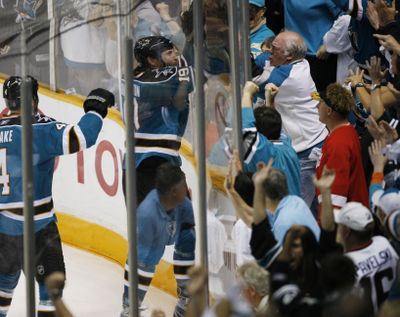 San Jose Sharks center Joe Thornton gestures to fans after scoring against the Detroit Red Wings in the second period.  (Associated Press)