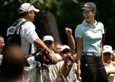 
Amateur Michelle Wie, right, shot 1-under at the John Deere Classic but missed making the cut by two strokes. 
 (Associated Press / The Spokesman-Review)