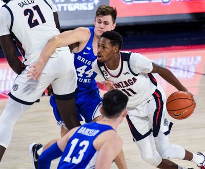 Gonzaga's Joel Ayayi drives into the lane during the second half of the Zags' win over BYU last Thursday.  (By Colin Mulvany / The Spokesman-Review)