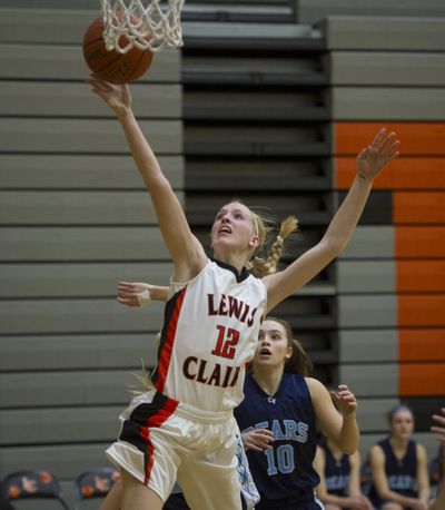 Lewis and Clark forward Emma Keenan drives to the basket during the first half on Tuesday. (Colin Mulvany)