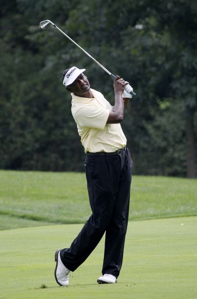 Vijay Singh watches his approach shot on the seventh fairway during the second round of the BMW Championship. (Associated Press)
