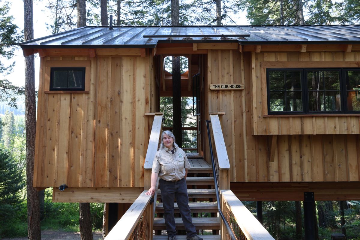 Mary McGraw, the park manager at Round Lake State Park, stands outside of the Cubhouse tree house on Tuesday near Sagle, Idaho.  (Mathew Callaghan/The Spokesman-Review)