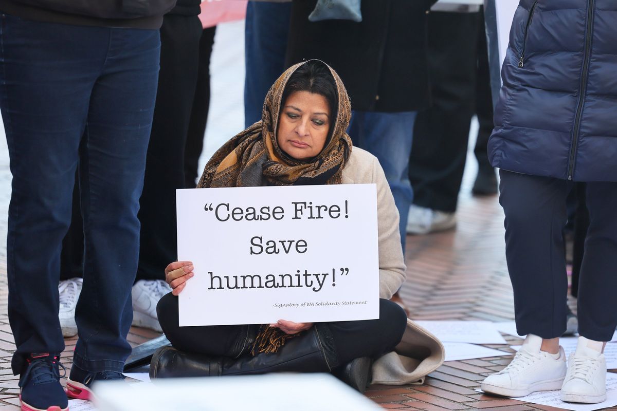 Afshan Khan during the interfaith rally calling for a cease-fire in Gaza Thursday afternoon in downtown Seattle.  (Kevin Clark/The Seattle Times/TNS)