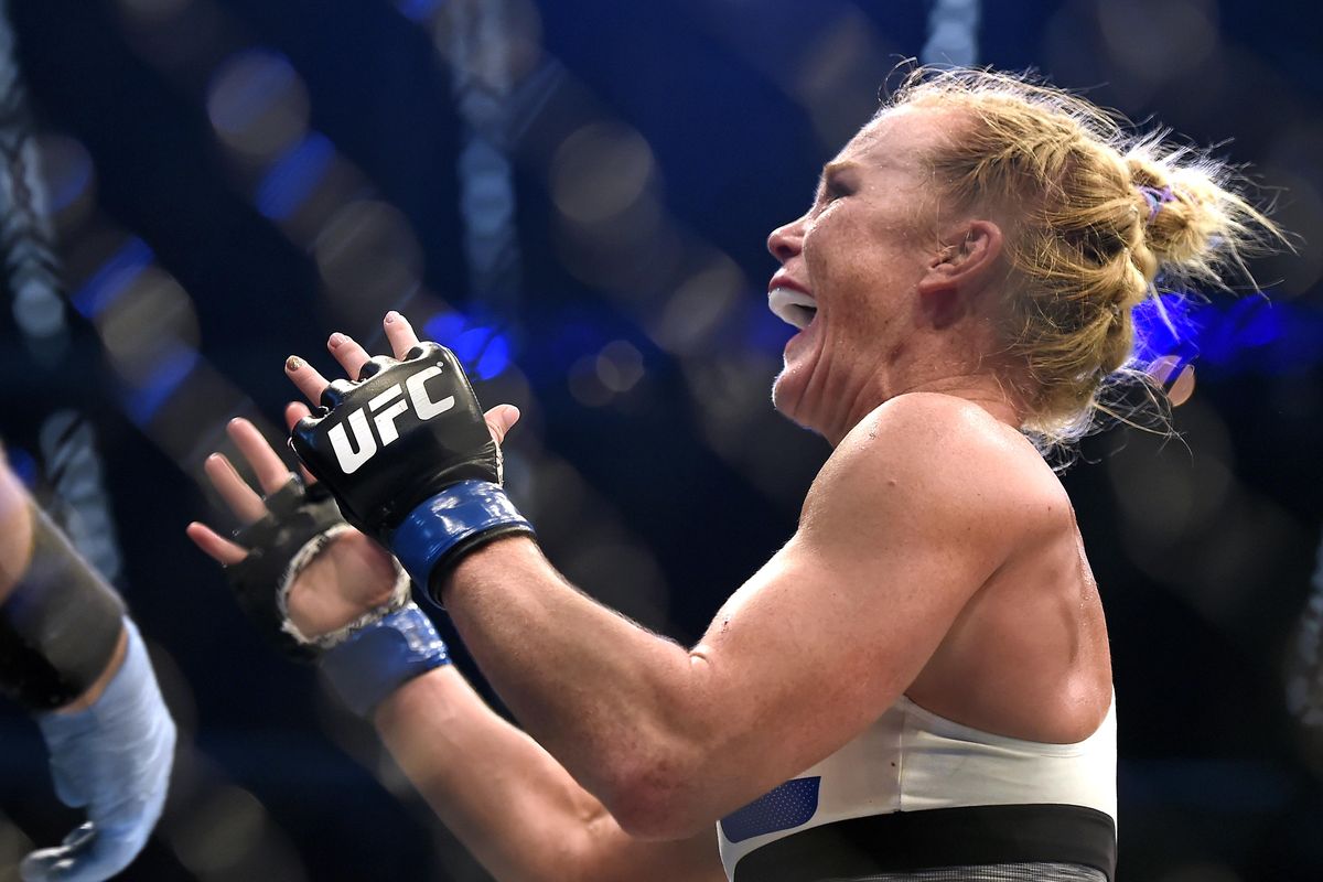 In this Nov. 15, 2015 file photo, Holly Holm celebrates after defeating Ronda Rousey during their UFC 193 bantamweight title fight in Melbourne, Australia. Holm is already the answer to a trivia question as the first fighter to dominate and defeat Ronda Rousey. She