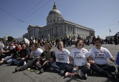 Protesters join at a major intersection following a state Supreme Court ruling on gay marriage in San Francisco, Tuesday. (Associated Press / The Spokesman-Review)