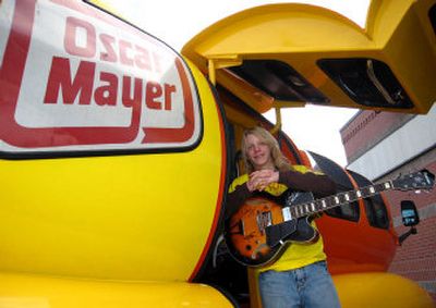 
Jeremiah Ourada, 14, poses along side the Weinermobile. Ourada, a West Valley High freshmen, is a finalist in the Oscar Mayer Sing the Jingle, Be a Star contest and gets to use the Weinermobile for a couple of days.
 (Christopher Rodkey / The Spokesman-Review)