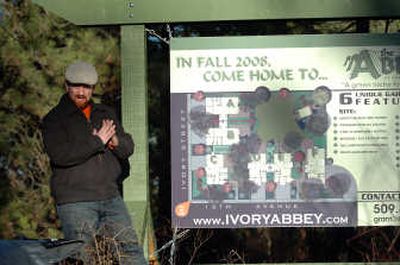 
Developer Grant Keller talks to a gathering of friends, family and associates while standing beside the site plan for a six-townhouse development called The Abbey at 1217 E. 15th on Spokane's South Hill  last Friday. 
 (Jesse Tinsley / The Spokesman-Review)
