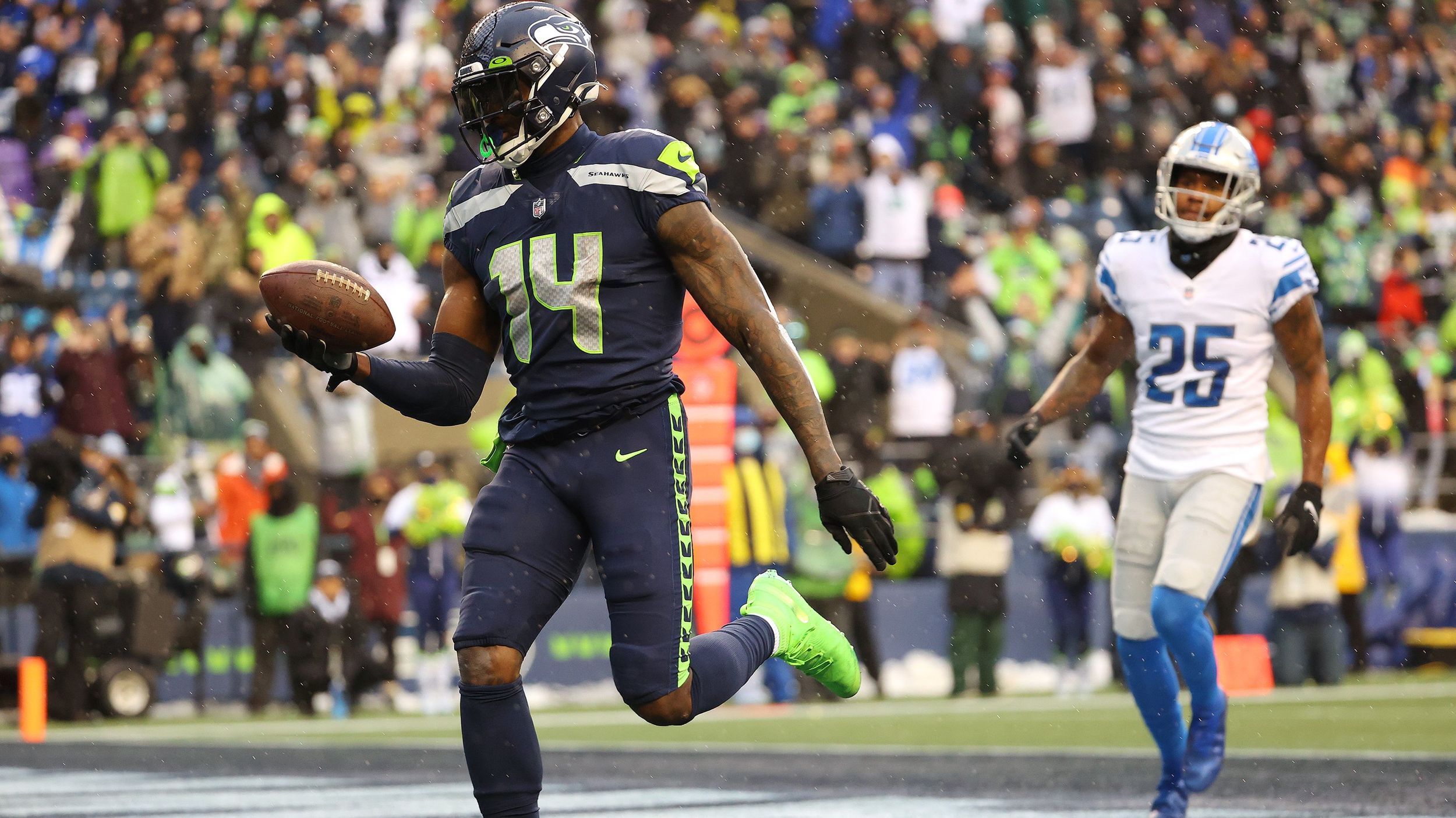 DK Metcalf of the Seattle Seahawks runs with the ball against the