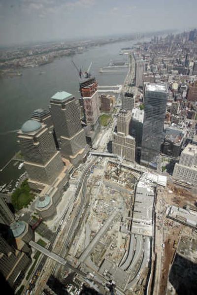 
The New York Police Department's high-tech surveillance helicopter hovers above ground zero Tuesday. Associated Press photos
 (Associated Press photos / The Spokesman-Review)