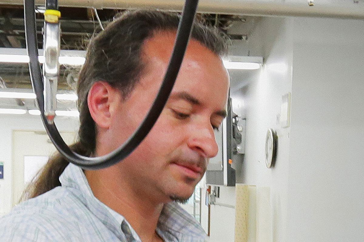 This July 2012 photo shows Andrew Engeldinger working at Accent Signage in Minneapolis. Police say the gunman who killed four people inside a Minneapolis sign company had been fired hours before the attack. Minneapolis Police Chief Tim Dolan told a Friday, Sept. 28, 2012, news conference that the gunman in Thursday