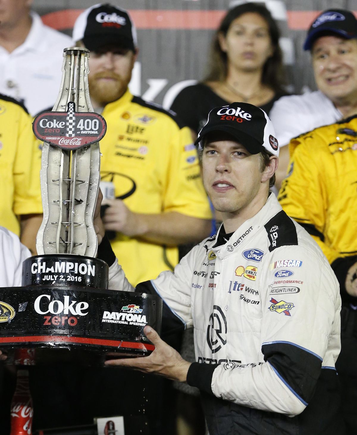 Brad Keselowski holds his trophy after winning the NASCAR Sprint Cup auto race at Daytona International Speedway. (Wilfredo Lee / Associated Press)