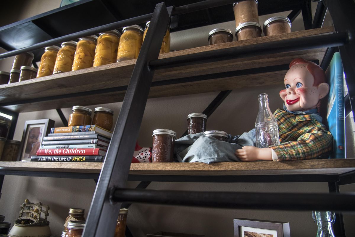 Minimalist Tammy Bell keeps a Howdy Doody doll, given to her by her mother, along with a few books and canned goods on a shelf near Bell’s living room. (Dan Pelle / The Spokesman-Review)