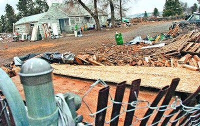 
Neighbors are upset about the dumping of construction debris in this vacant lot, shown Wednesday, at the corner of Crestline and Lincoln in Spokane. 
 (Christopher Anderson / The Spokesman-Review)