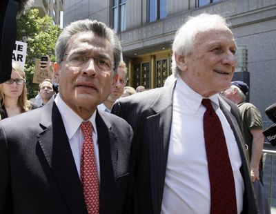 Rajat Gupta, left, and attorney Gary Naftalis leave federal court Friday in New York. (Associated Press)
