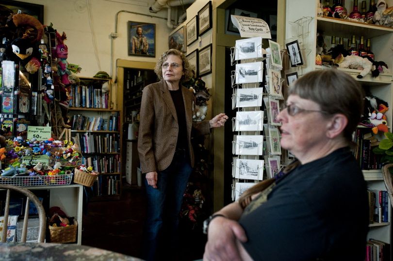 Bobbie Beese, left, and Betsy Mott are seen in their store on Tuesday at the Corner Door Fountain and Books in Spokane Valley. (Tyler Tjomsland)