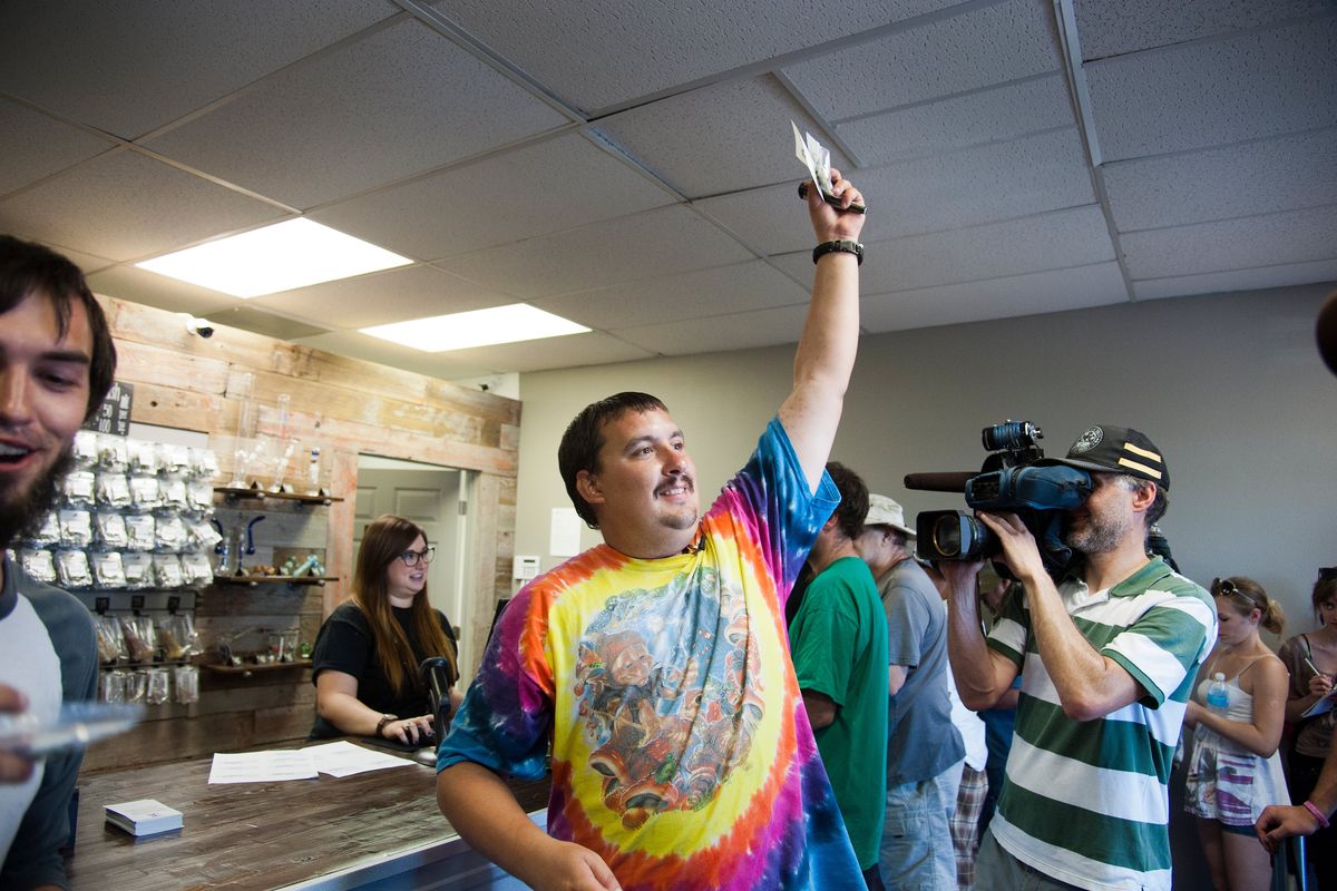 Mike Boyer was the first in line at Spokane Green Leaf to purchase marijuana on July 8, 2014, the first day marijuana could be purchased legally in Spokane County.  (DAN PELLE)