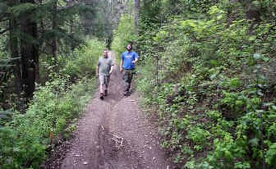 
Cory Day, left, and Shane Warner hike Canfield Mountain Trail No. 10.
 (The Spokesman-Review)
