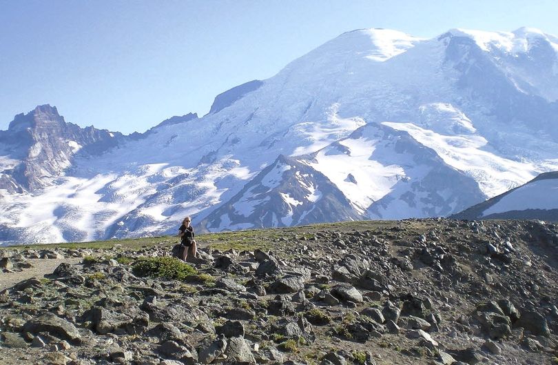 A visitor explores the hiking trails near the Sunrise area of Mount Rainier National Park. (Associated Press)
