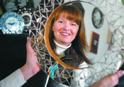 
Reflected in a mirror she created, Keresha Riley makes mosaic pieces using ceramic tiles, glass, mirrors and other materials.
 (photos by Holly Pickett/The Spokesman-review / The Spokesman-Review)