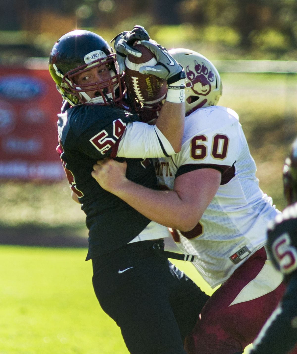 Whitworth’s Drew Powell, left, intercepts a pass while under pressure from Blake Ahlers. (Colin Mulvany)