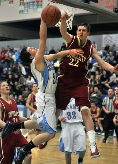 U-Hi’s Brett Bailey (22) swats CV's Garret Sawyer's shot attempt out of bounds. (Dan Pelle)