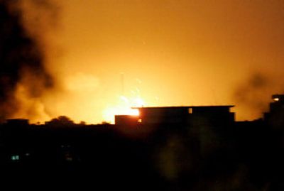 
Explosions at a U.S. base's ammunition depot illuminated the sky over Baghdad early today.  A fire broke out  Tuesday night, setting off a series of explosions from detonating shells. 
 (Associated Press / The Spokesman-Review)
