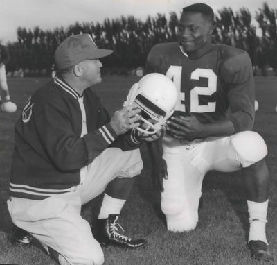 Washington State football player George Reed with coach.  (Spokesman-Review Photo Archives)