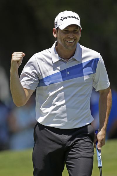 Sergio Garcia fired a 7-under 65 and finds himself on top of the leaderboard, one shot ahead of Tiger Woods, who shot a 67. (Associated Press)