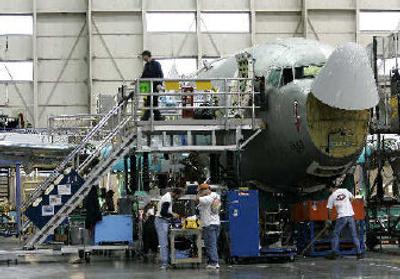 
Workers at the Boeing Co.'s 737 assembly plant in Renton, Wash. prepare for a shift change. Boeing Co. has agreed to pay $615 million to end a three-year Justice Department investigation into reported defense contracting scandals. 
 (Associated Press / The Spokesman-Review)