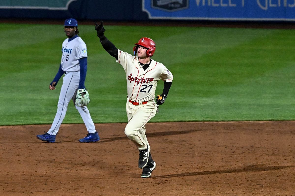 Spokane’s Max Belyeu rounds second base after hitting the second of consecutive home runs Friday during a Northwest League game against Everett at Avista Stadium .  (Colin Mulvany/The Spokesman-Revi)