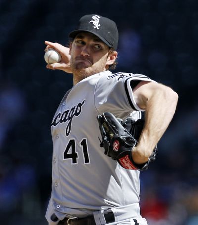 Chicago White Sox starting pitcher Phil Humber throws against the Seattle Mariners in the second inning in a baseball game Saturday, April 21, in Seattle. (Associated Press)