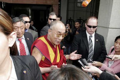 
The Dalai Lama speaks with reporters outside his hotel Tuesday after a meeting with President Bush in Washington, D.C.Associated Press
 (Associated Press / The Spokesman-Review)