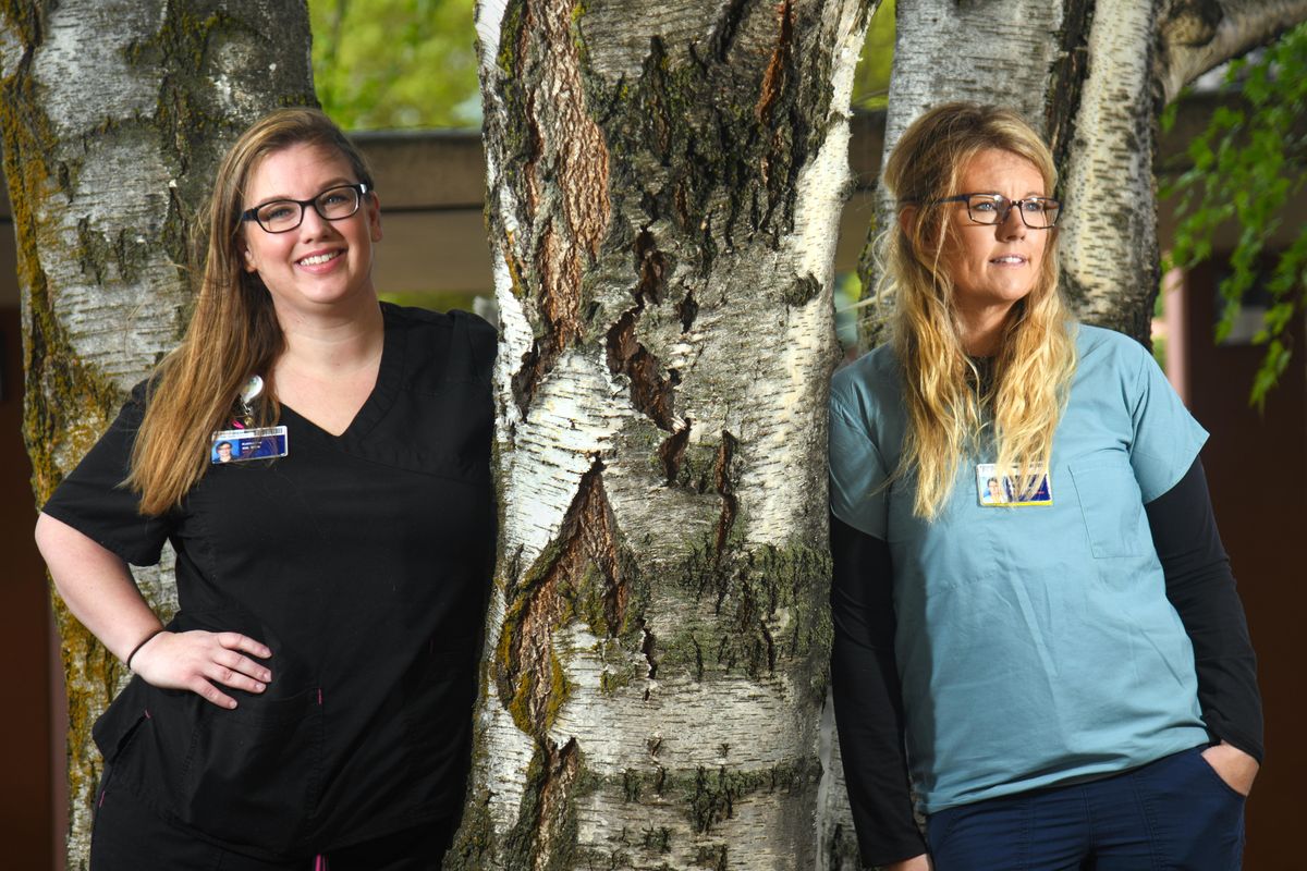 Katherine Taylor, left, is an RN in the ICU, and Denell Allen is a respiratory therapist at Providence Holy Family Hospital. (Dan Pelle / The Spokesman-Review)