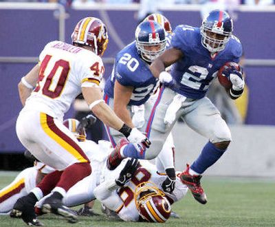 
Tiki Barber of the Giants, who says he intends on retiring after this season, looks forward to life after football. 
 (Associated Press / The Spokesman-Review)