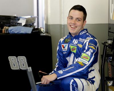 Alex Bowman smiles to team members in his garage during a practice session for the Clash NASCAR auto race at Daytona International Speedway, Friday, Feb. 17, 2017, in Daytona Beach, Fla. (Terry Renna / Associated Press)