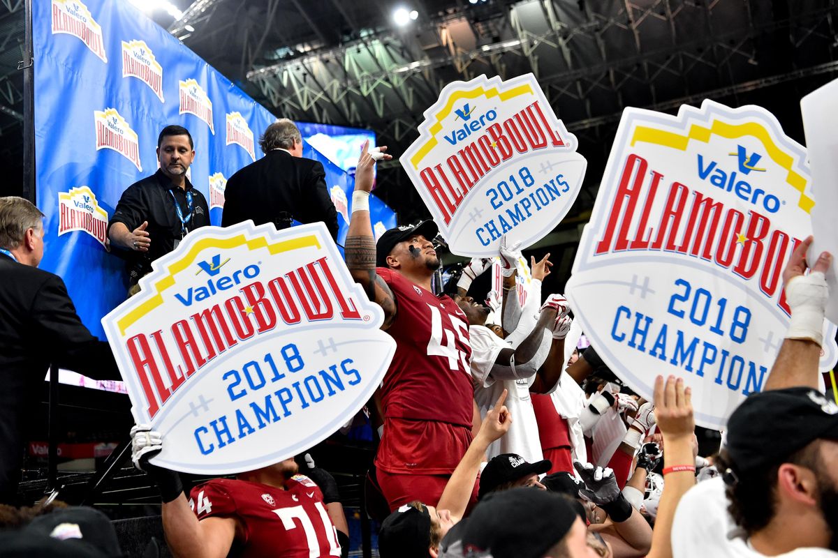 Washington State Cougars defensive lineman Logan Tago (45) celebrates with teammates after defeating the Iowa State Cyclones during the second half of the 2018 Alamo Bowl on Friday, December 28, 2018, at the Alamo Dome in San Antonio, TX. WSU won the game 28-26. (Tyler Tjomsland / The Spokesman-Review)