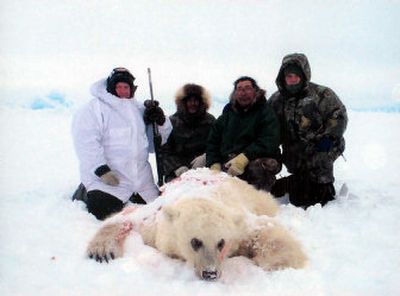 
Hunter Jim Martell, left, poses last month with a hybrid bear he shot  on a hunting expedition on Banks Island, Northwest Territories, Canada. 
 (Associated Press / The Spokesman-Review)