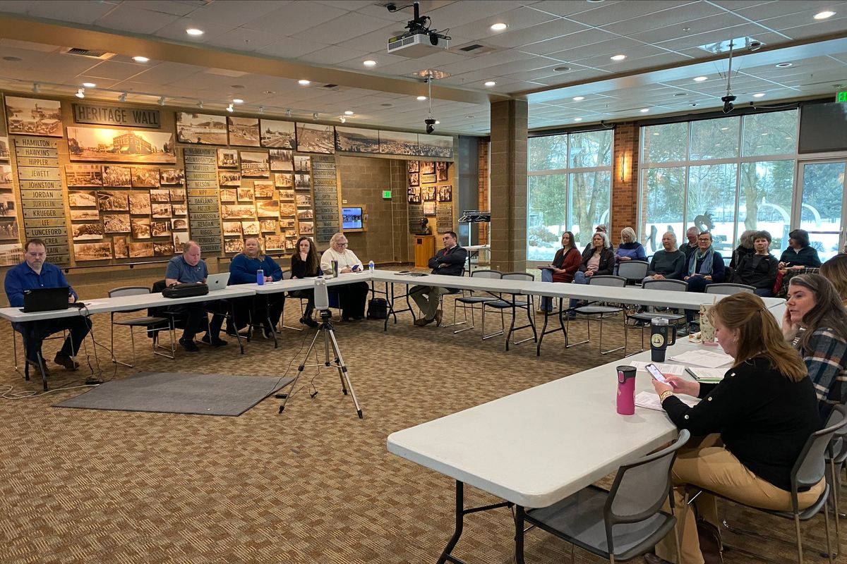 Members of North Idaho’s interlibrary loan consortium, the Cooperative Information Network, meet Feb. 19 at the Coeur d’Alene Library to discuss its joint powers agreement and the Community Library Network’s minors’ library card policy. (James Hanlon/The Spokesman-Review)