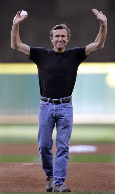 
Mountaineer Ed Viesturs waves to the crowd before tossing out the ceremonial first pitch at a Seattle Mariners game. 
 (Associated Press / The Spokesman-Review)
