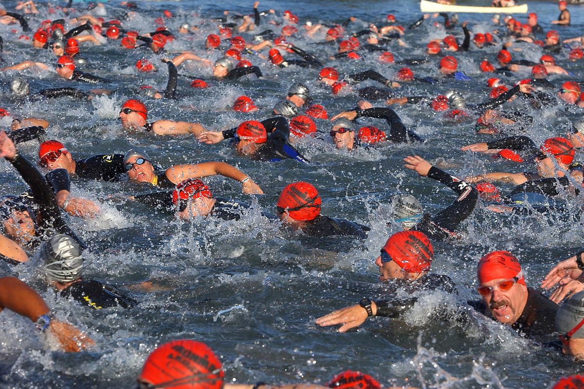 A mass of humanity piles into the water for the first Coeur d’Alene Ironman race Sunday, June 29, 2003. (Jesse Tinsley / The Spokesman-Review)