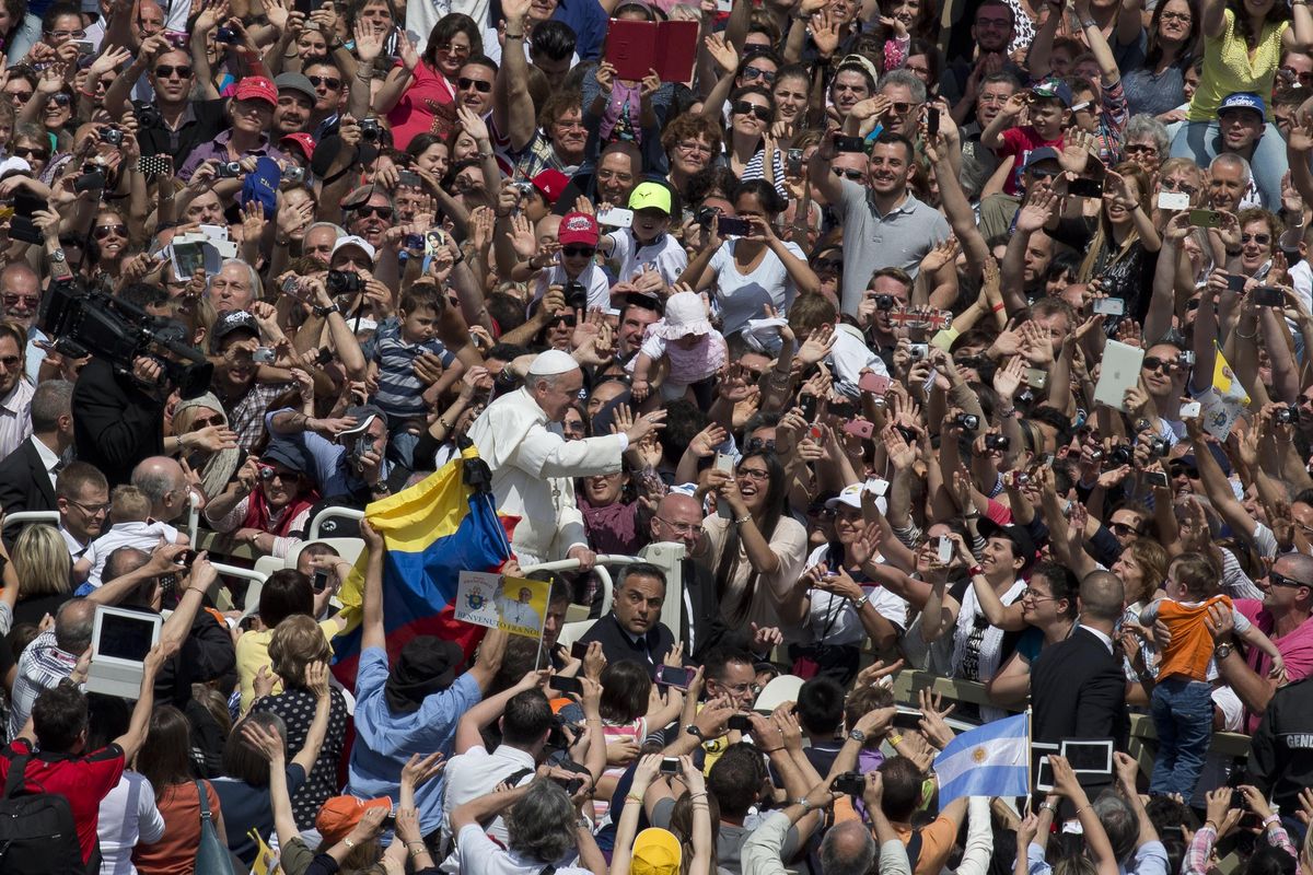 Pope Francis waves to the crowd after a canonization ceremony Sunday in St. Peter’s Square at the Vatican. (Associated Press)