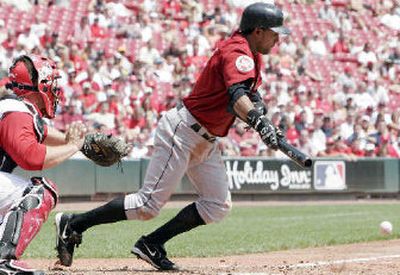 
Willy Taveras bunts for a single in the fifth inning of game Wednesday. 
 (Associated Press / The Spokesman-Review)