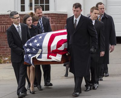A somber day: Family members carry the casket of former Democratic U.S. senator and three-time presidential candidate George McGovern as it is being transported to the Washington Pavilion of Arts and Science in Sioux Falls, S.D., for the funeral Friday. McGovern died Sunday at age 90. (Associated Press)