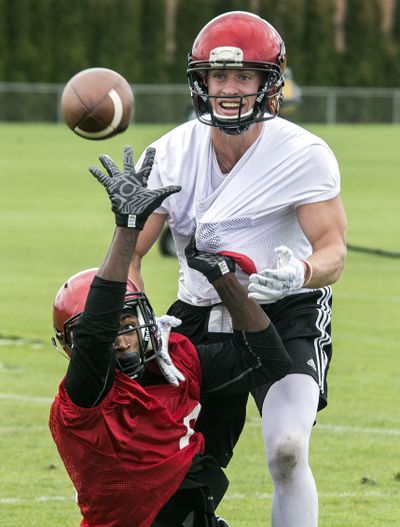 On Saturday in Martin Stadium, all eyes will be on Eastern Washington’s all-everything receiver Cooper Kupp, top, battling teammate D’londo Tucker in practice. (Dan Pelle / The Spokesman-Review)