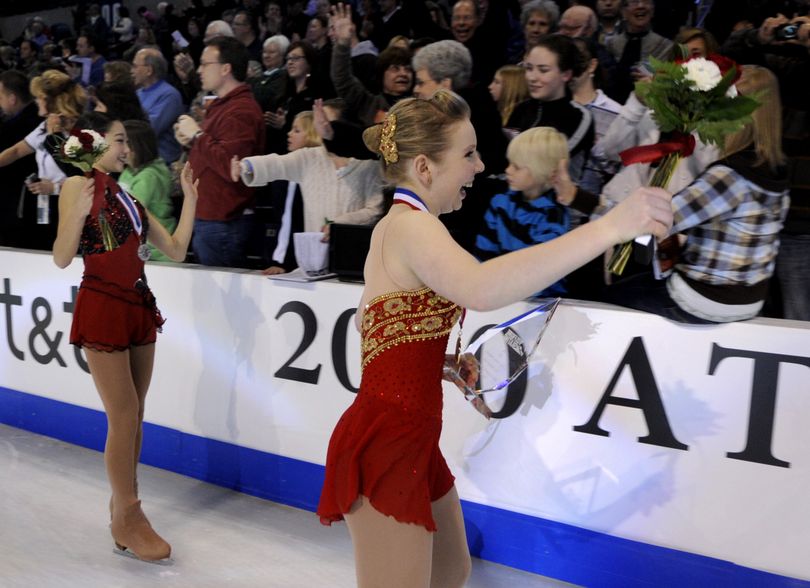 Championship ladies free skate silver medalist Mirai Nagasu, left, and gold medalist  Rachael Flatt, take a victory lap at the medal ceremony Sat. Jan. 23, 2010 in the Spokane Arena. (Colin Mulvany / The Spokesman-Review)