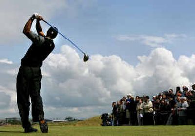 
Tiger Woods is in the swing of things at the British Open, as he has kept himself in contention going into today's final round as he looks to end his majors drought. 
 (Associated Press / The Spokesman-Review)